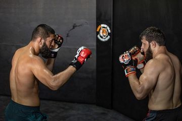 Instagram post by @khamzat_chimaev for RDX Sports. Caption reads: @rdx_sports 👊🏼🥇.