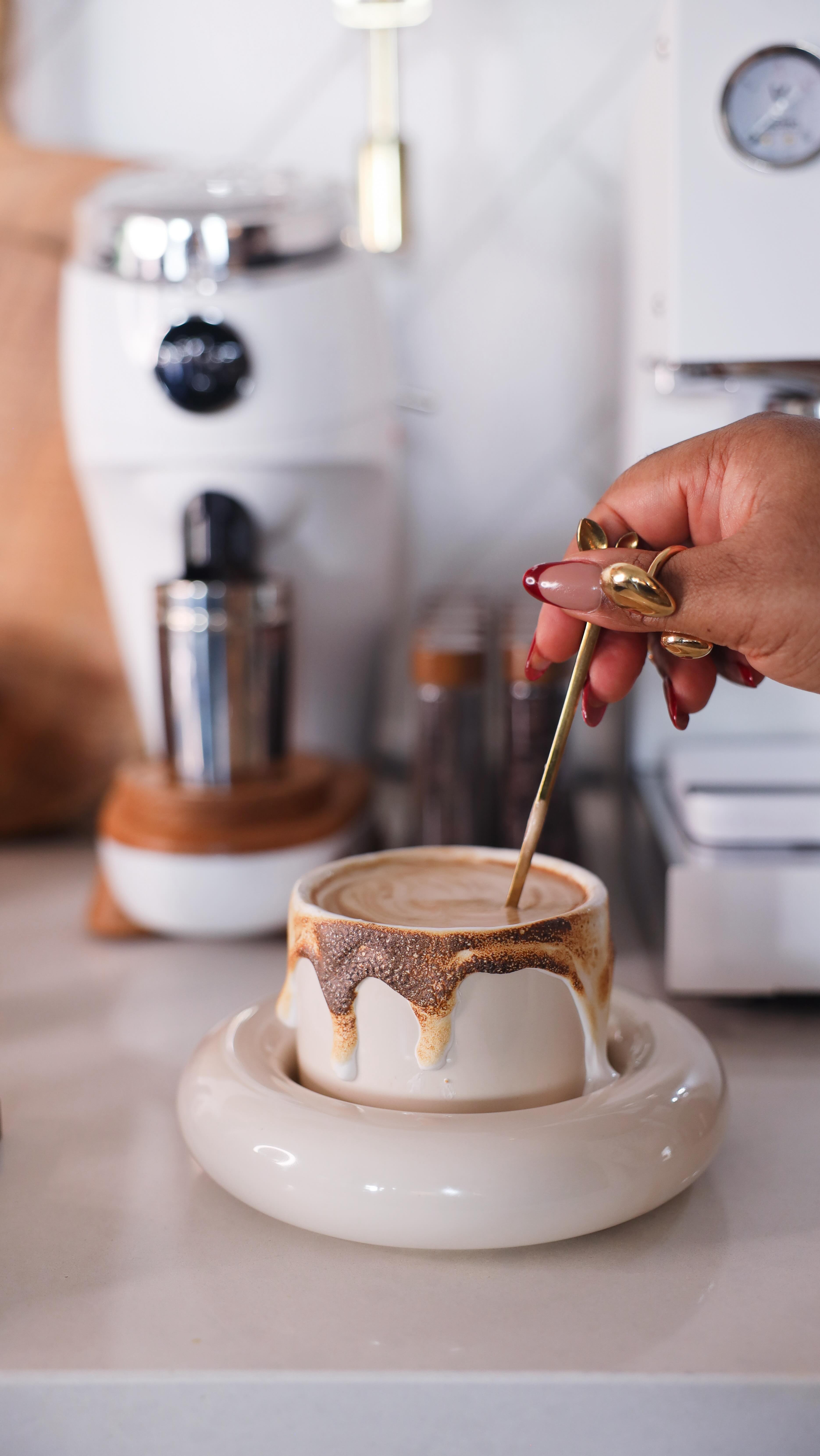 Instagram post by @charlottesmythee for nutpods. Caption reads: Drop “Cawfee” below to shop my coffee bar....