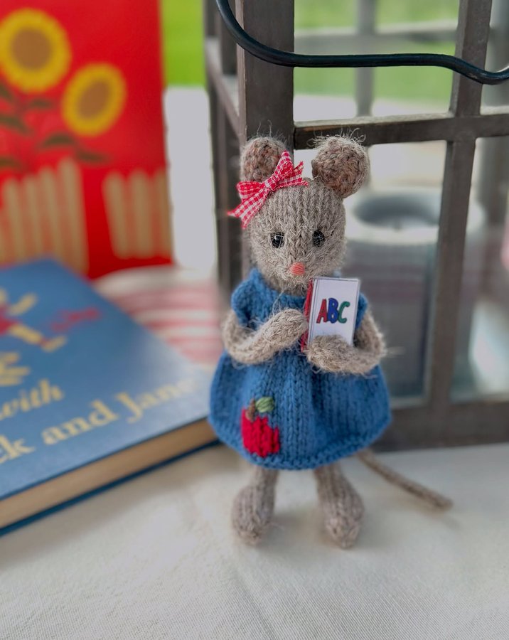 Instagram post by @warmwoolenwishes for Knit Picks. Caption reads: This sweet little mouse is excited for her first....
