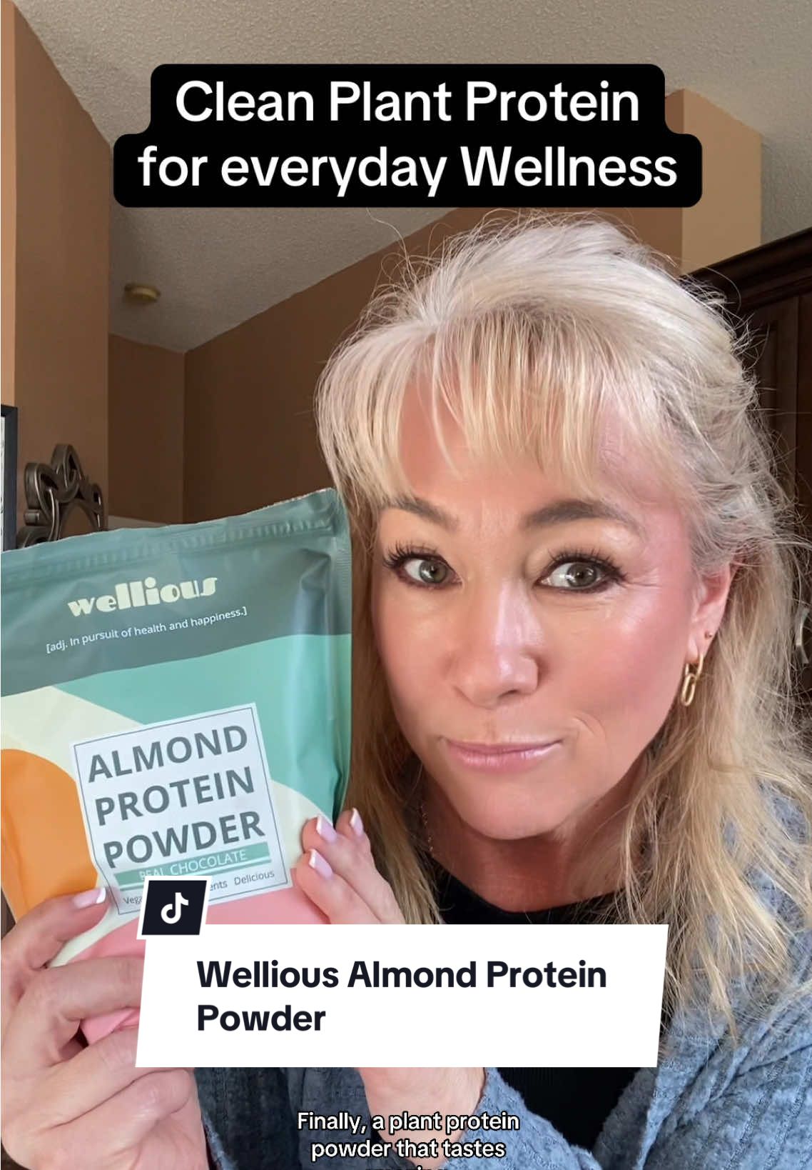 TikTok post by @fabulous50s for Wellious. Caption reads: Wellious Almond Plant Protein is Delicious! With....