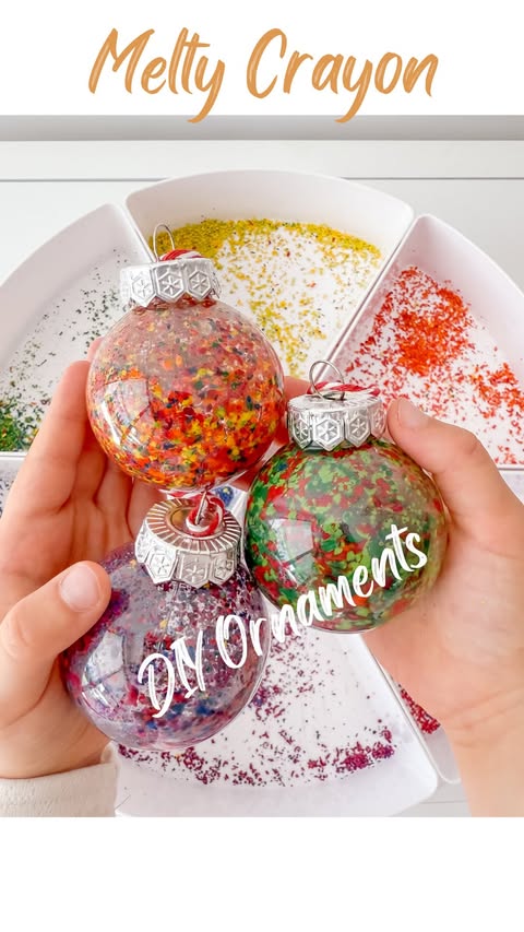 Instagram post by @playful.childhood for Crayola. Caption reads: Grated crayons + clear baubles + a hair dryer =....