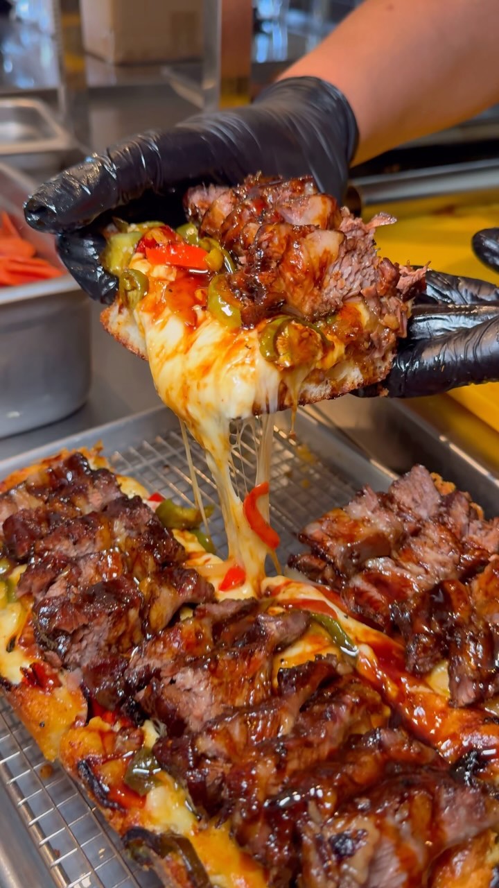 Instagram post by @hangryblogger for Eater LA. Caption reads: Introducing the GRAND SHORT RIB PAN PIZZA! You’re....