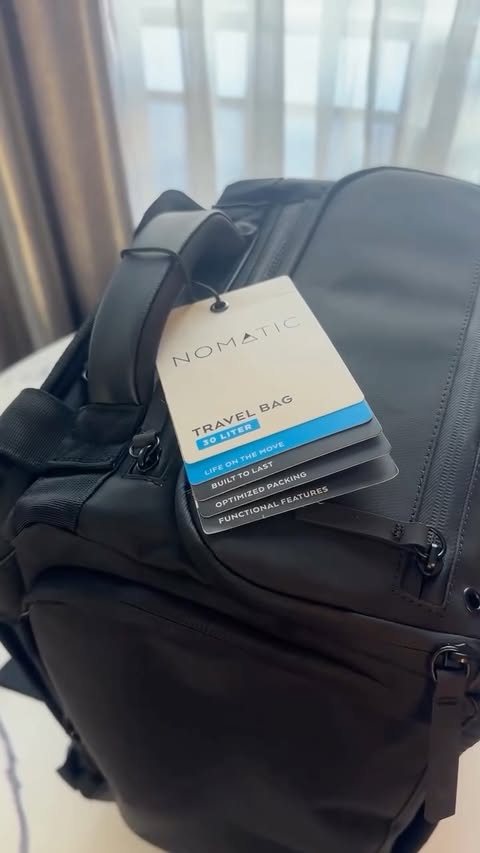 Instagram post by @mimkato for NOMATIC. Caption reads: My new NOMATIC Travel Bag & Carry-On✨I love them....