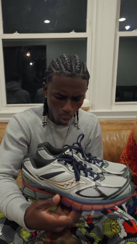 Instagram post by @lucius_firmin for Saucony. Caption reads: [...] Year! #FootLockerPartner @footlocker....