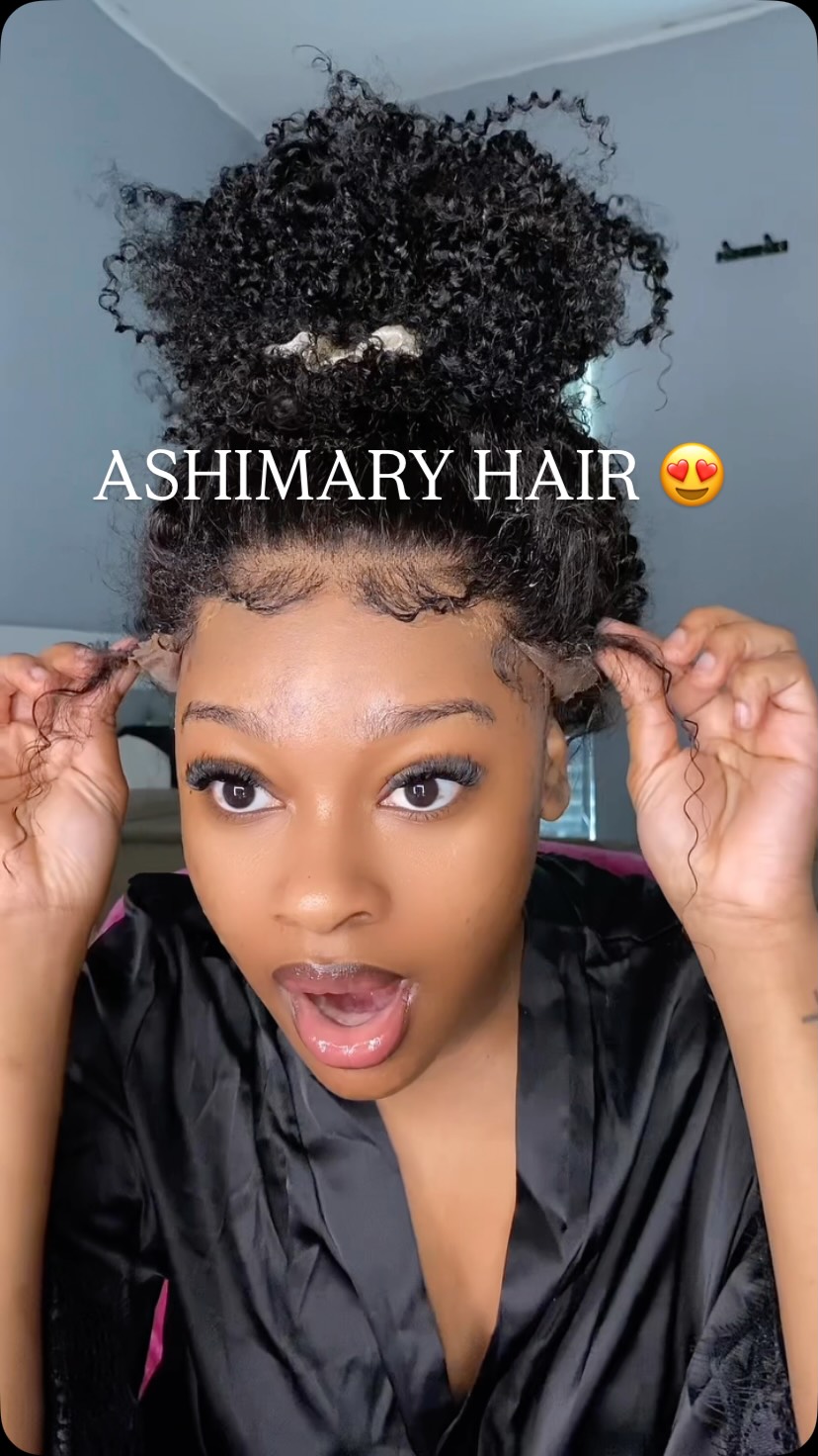Instagram post by @simplycarlaj for Ashimary Hair. Caption reads: Ashimaryhair 360 Invisi Strap Kinky Curly Wig With....