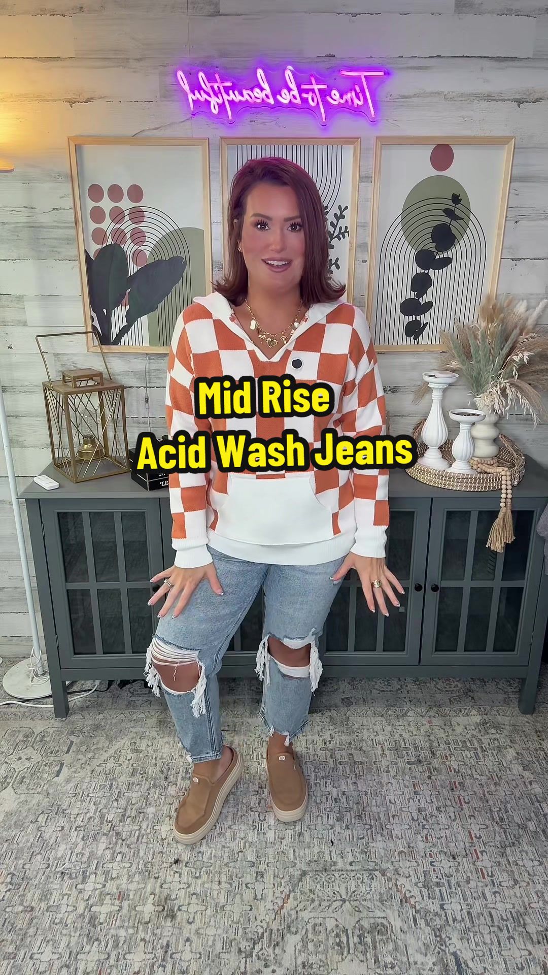 TikTok post by @katrinagmoore for Freckled Poppy. Caption reads: These acid wash mid rise jeans are such a vibe!!!....