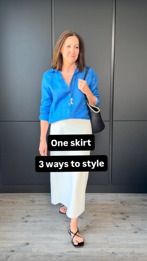Instagram post by @buttonsandblazers for White Stuff. Caption reads: This skirt has been worn on repeat since it....