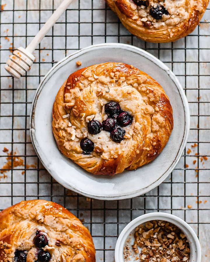 Instagram post by @rushyama for Bake from Scratch. Caption reads: Grape ricotta danishes with walnut thyme streusel!....