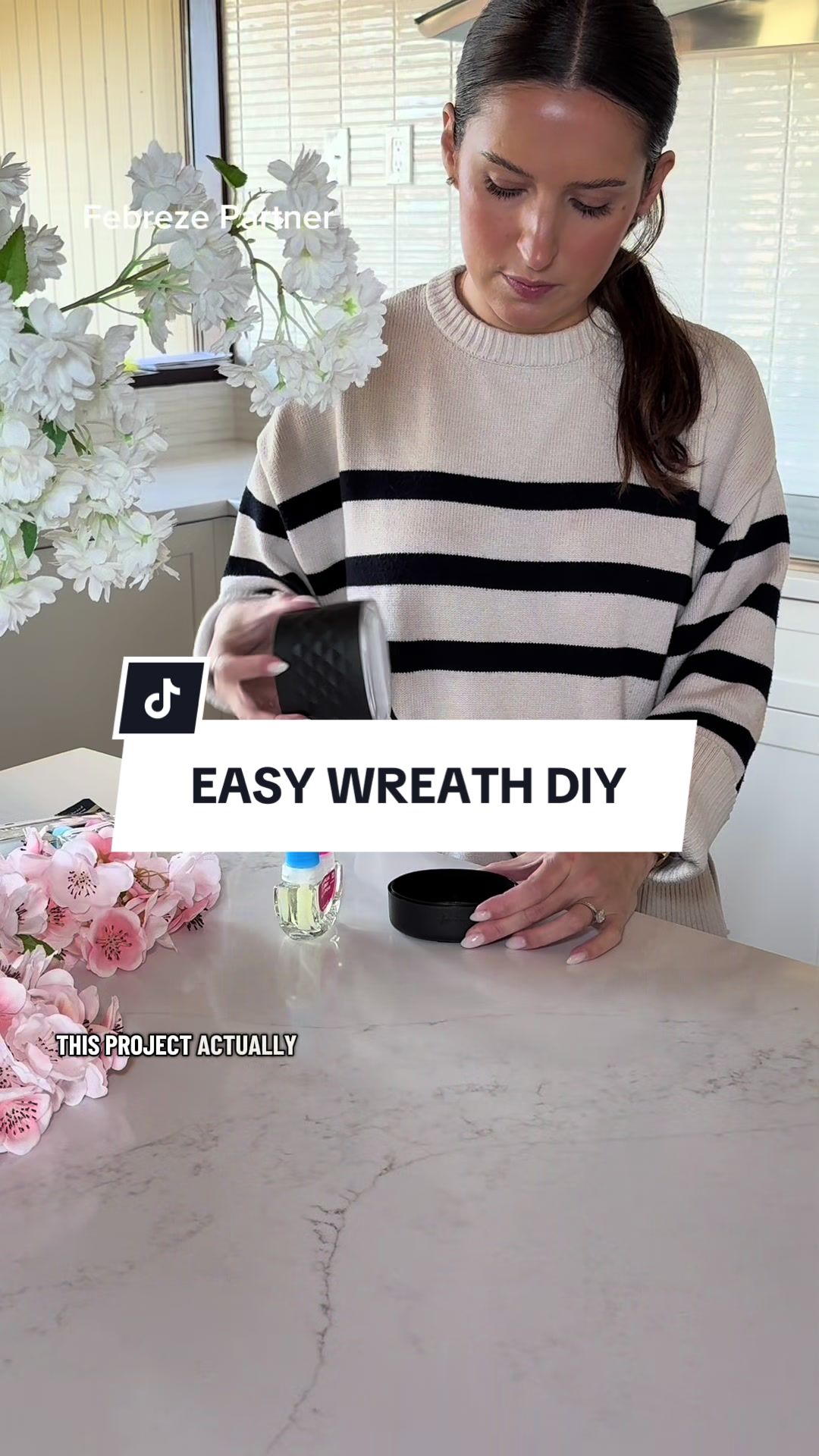 TikTok post by @the_avantgarde for Febreze. Caption reads: [...] scent that complements my decor. 🤭....