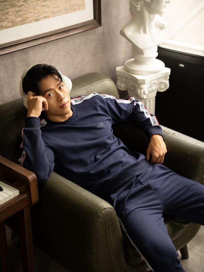 Instagram post by @michaeltruong_official for Moschino. Caption reads: Just here minding my own business…in Moschino....