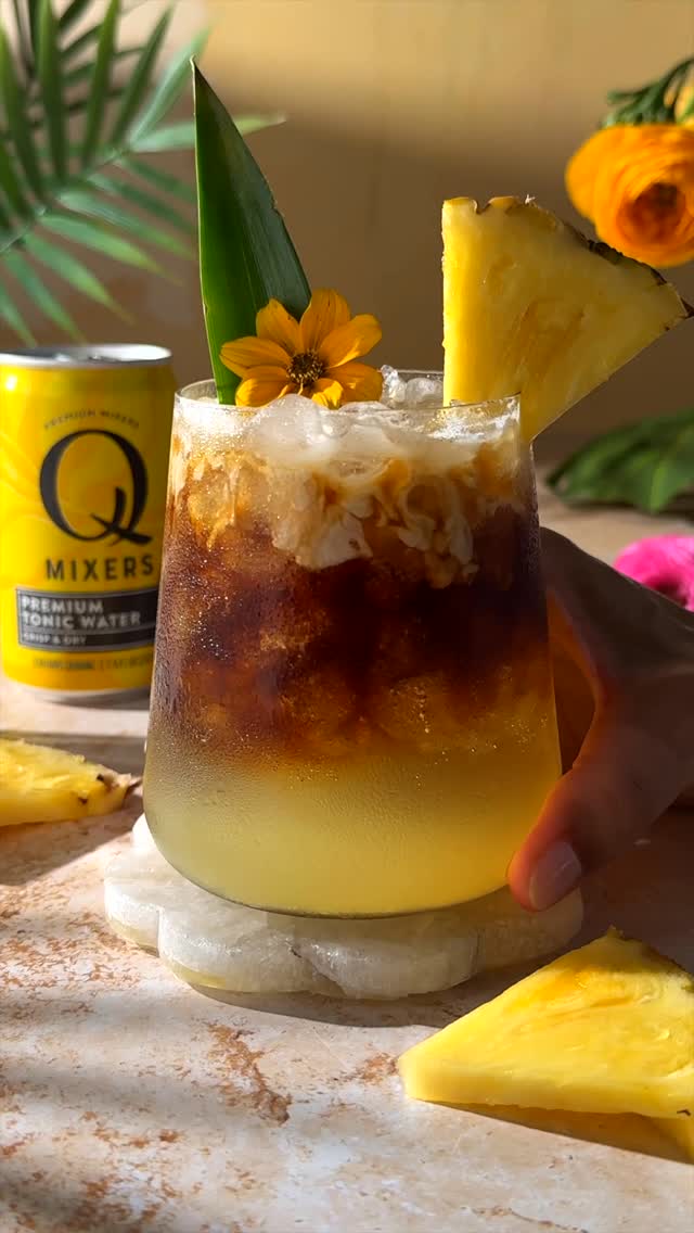 Instagram post by @thesocialsipper for Q Mixers. Caption reads: Swap your afternoon iced coffee for this Tropical....