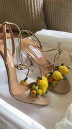 Instagram post by @sheneawalker for AQUAZZURA. Caption reads: The most perfect vacation/summer shoe ever 🍋🐝....