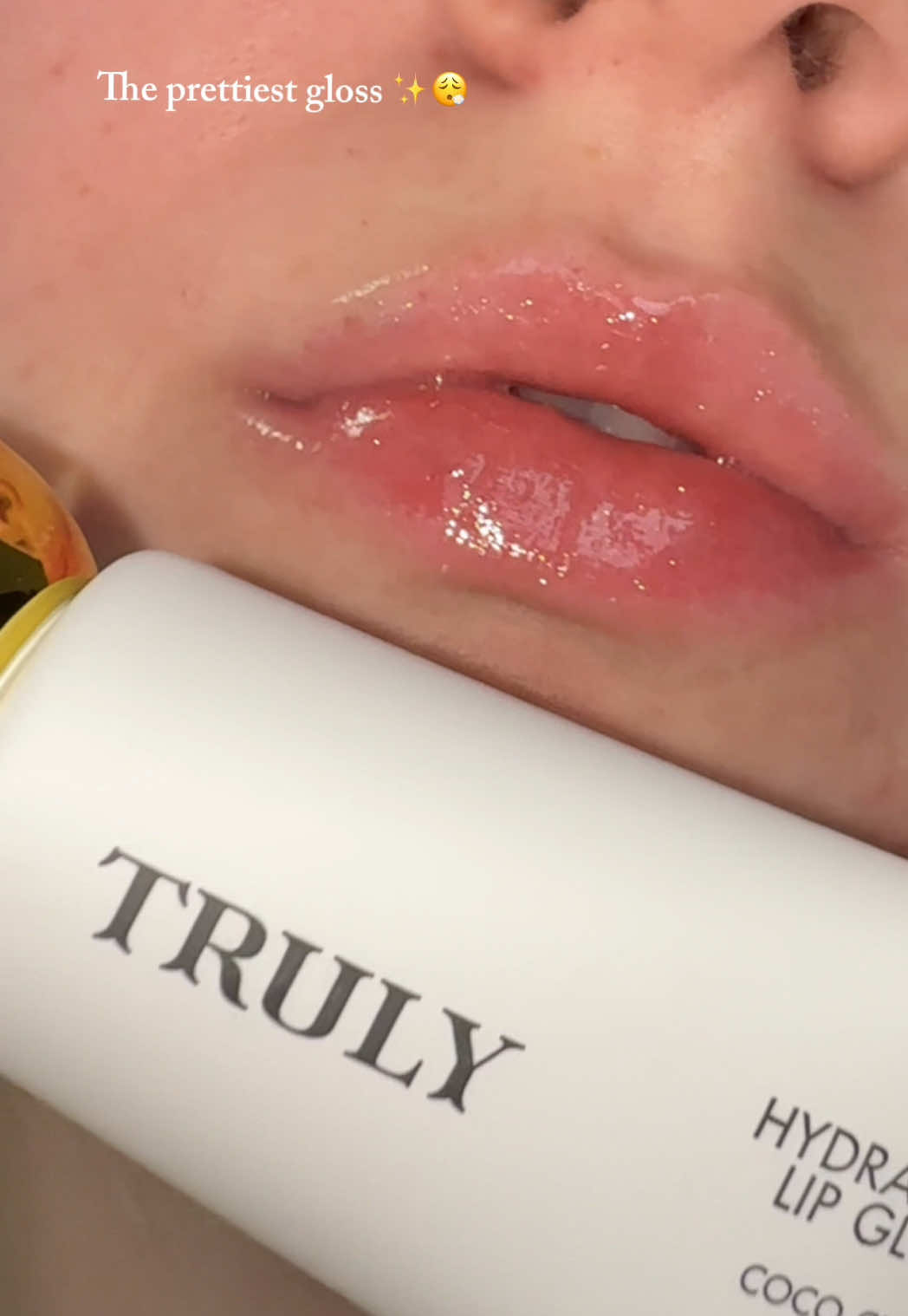 TikTok post by @kaeleighelizabeth for Truly Beauty. Caption reads: [...] prettiest glosses from Truly. 💄💋@Truly....