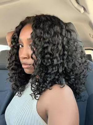 TikTok post by @talaniilee for CurlyMe Hair. Caption reads: Indian curly—is the new Burmese 🤨 @CurlyMe Hair....