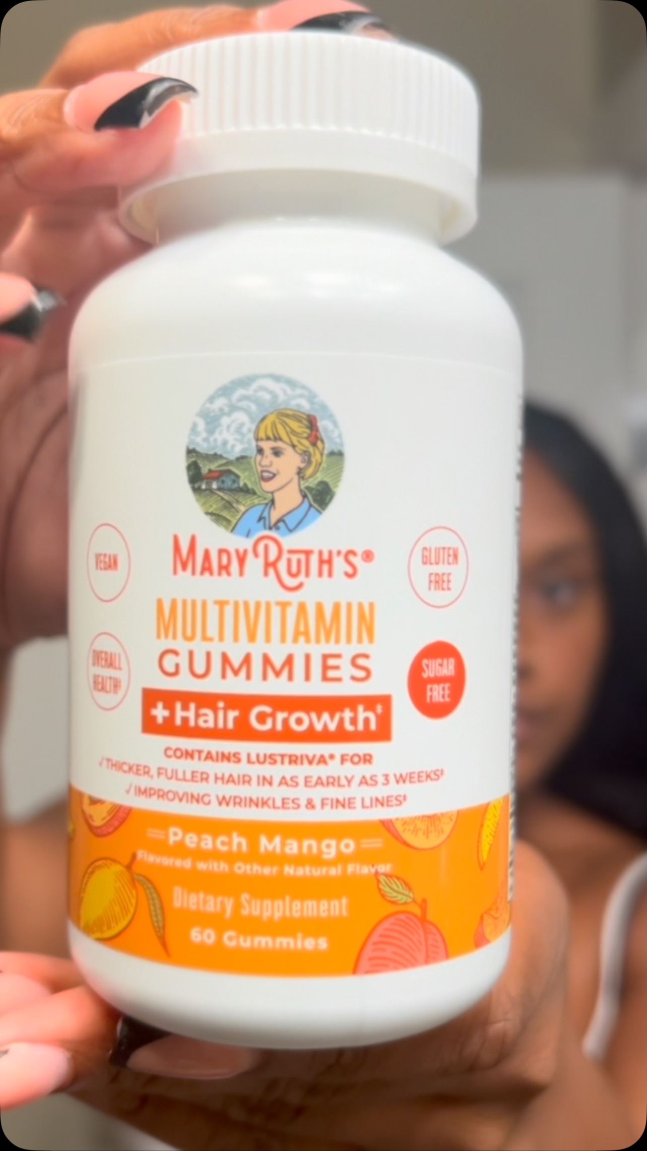 Instagram post by @adriane_christine for MaryRuth Organics. Caption reads: Healthy hair under the braids? Yes ma’am.....