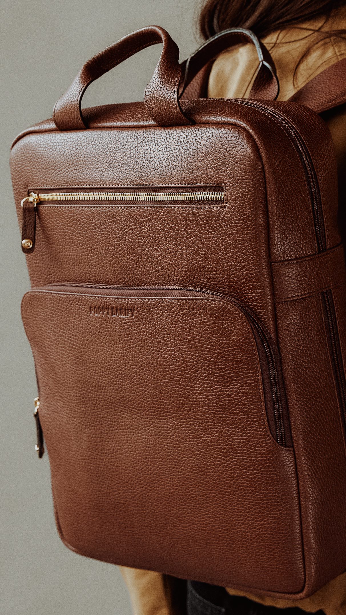 Instagram post by @gabrielleassaf for POPPY BARLEY. Caption reads: [...] refined backpack in french press from....