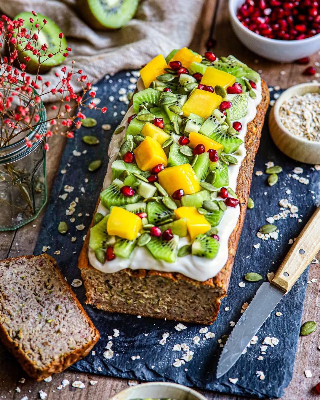 Instagram post by @lennaomrani for THRIVE Magazine. Caption reads: TROPICAL COURGETTE CAKE! 🥭🥝🤯 (vegan &....