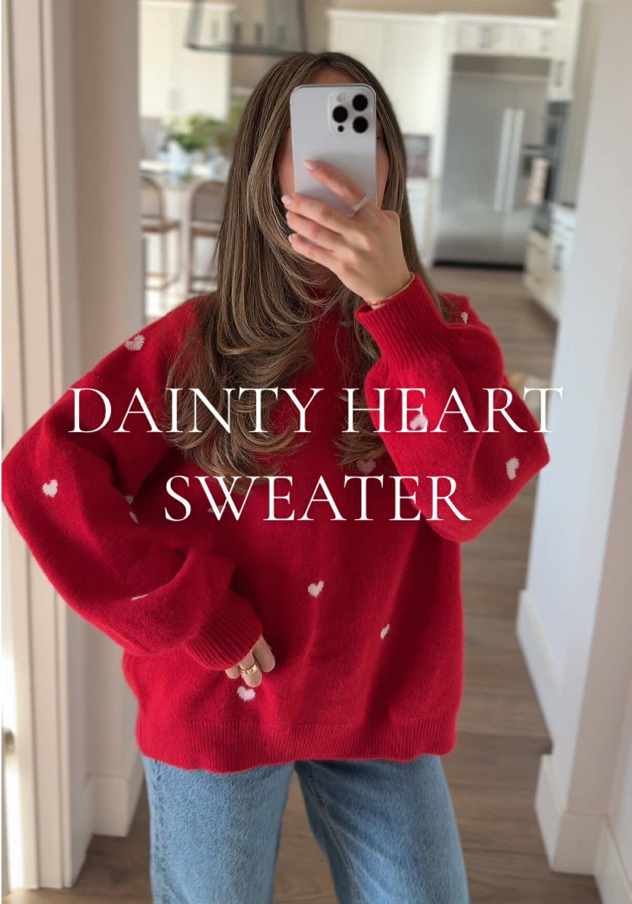 TikTok post by @briannametzger1 for YouAnnn. Caption reads: [...] hips). #sweater #heart #valentinesday....