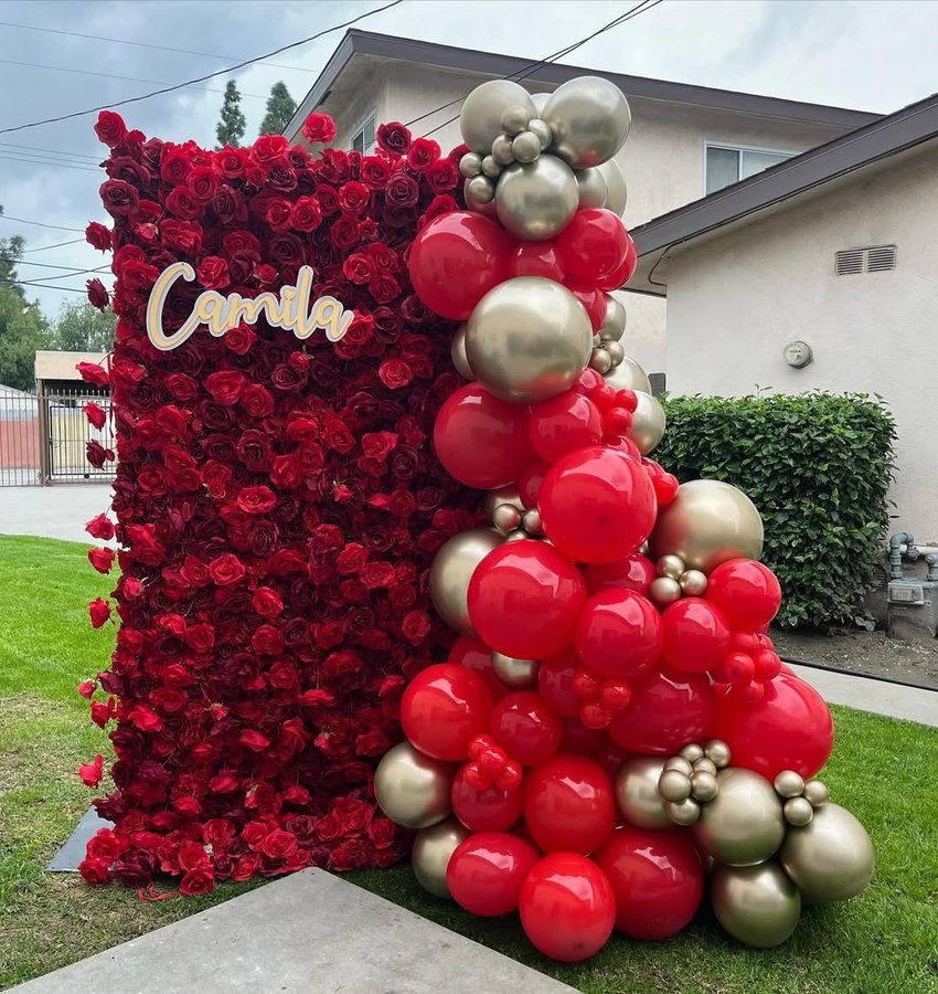 Instagram post by @events.by.maggie for KetieStory. Caption reads: Our Red Selena flower wall can also be turned into....