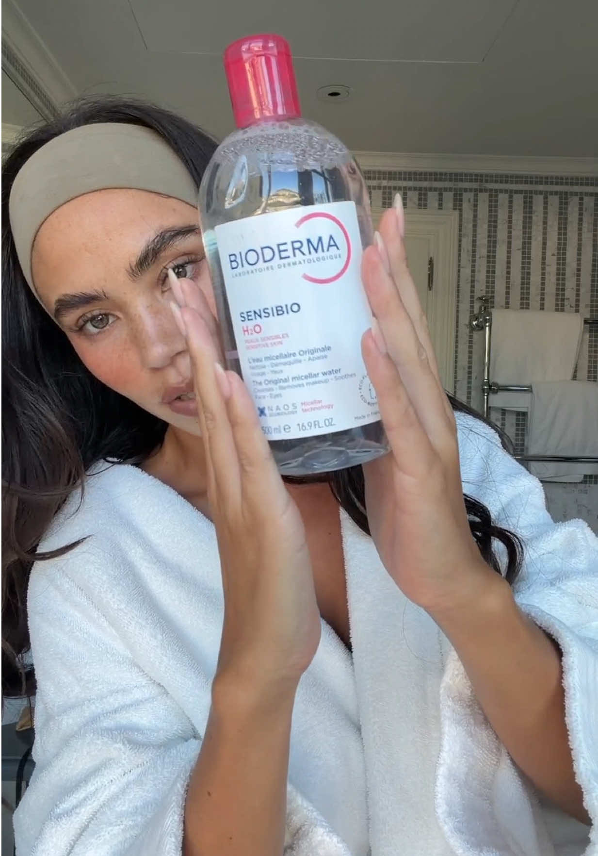 TikTok post by @christinanadinx for BIODERMA USA. Caption reads: Less is more🧘🏻‍♀️🫧 in @BIODERMA USA we trust....