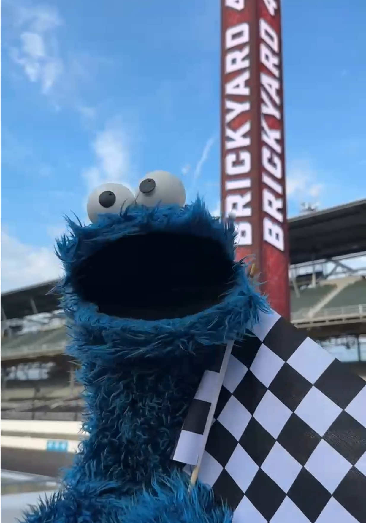 TikTok post by @sesamestreet for NASCAR. Caption reads: [...] 🍪🏁 #brickyard400 #sesameroadtrip #nascar....