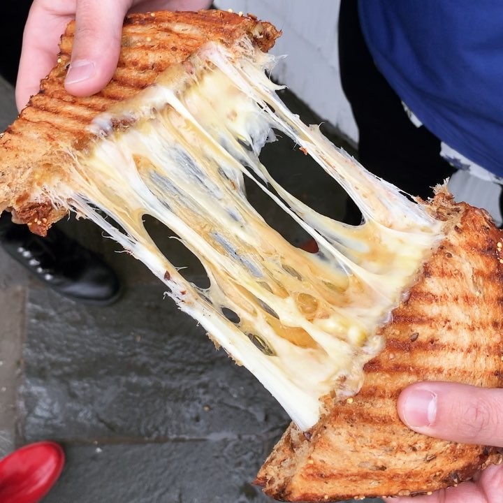 Instagram post by @thelifoodie for Discover Long Island. Caption reads: [...] this beauty at @brewcheeseli 🙌🏻....