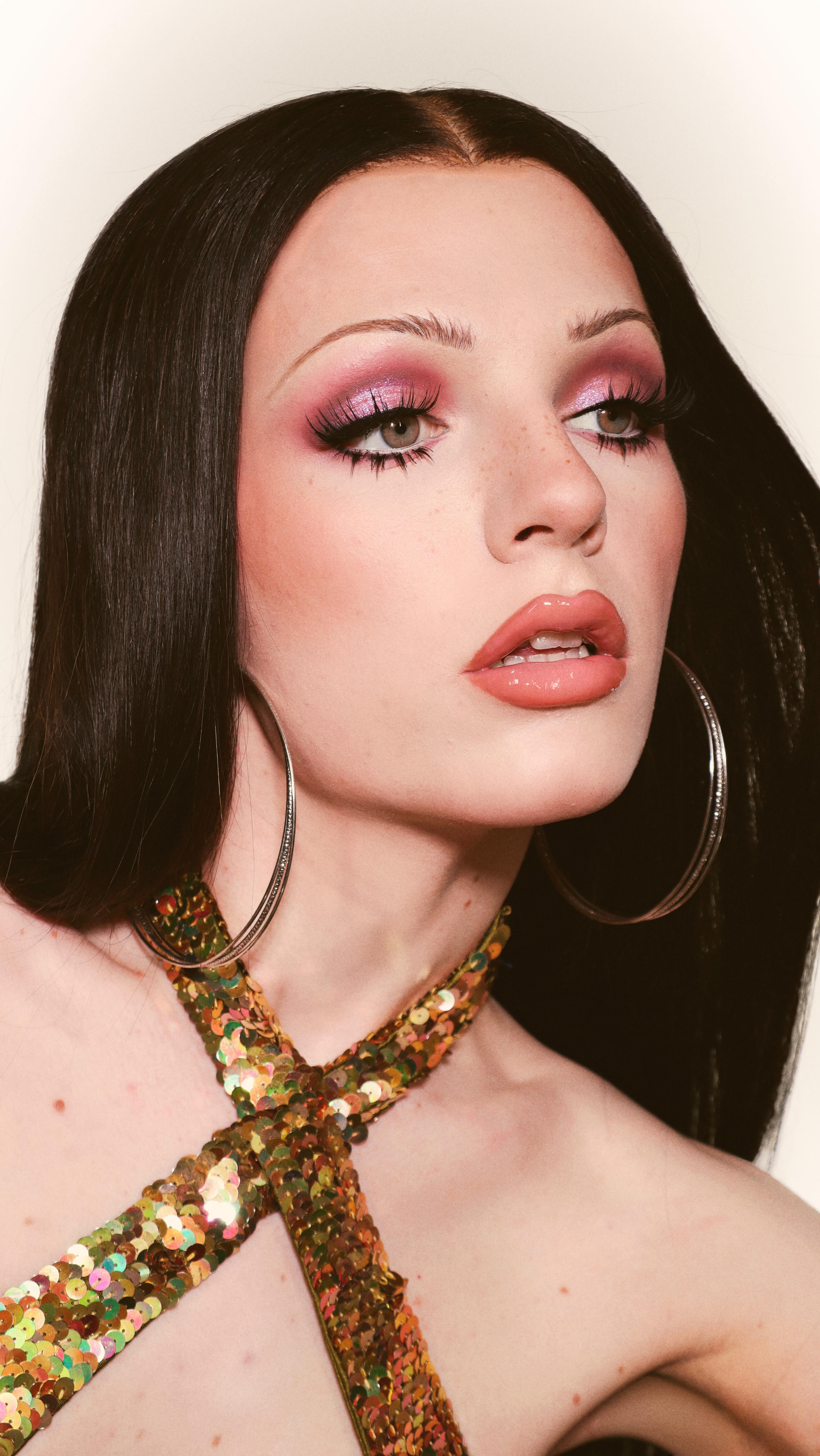 Instagram post by @dakota.schiffer for LANEIGE. Caption reads: 70s Cher! Celebrating Pride channelling the....