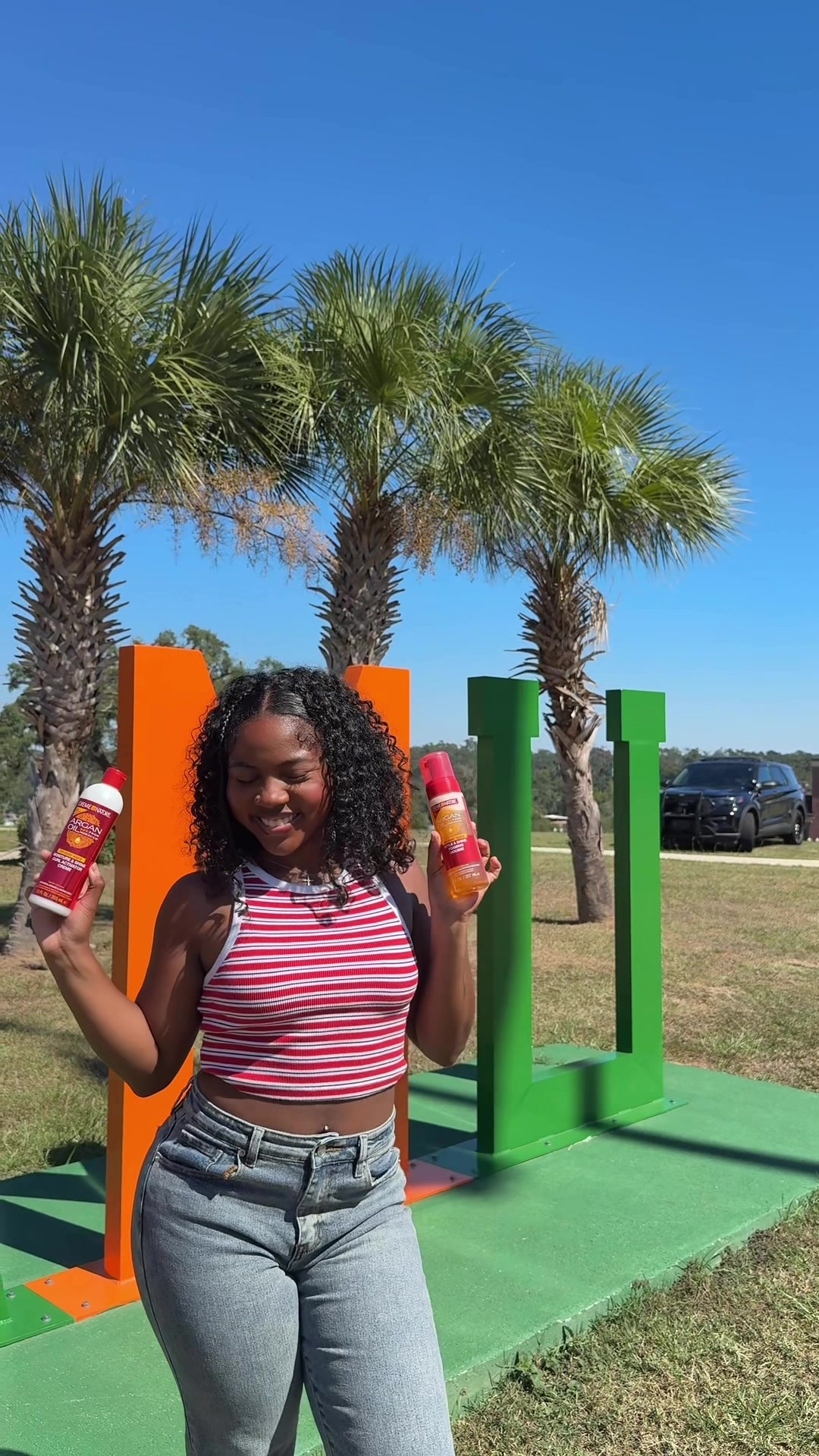 TikTok post by @liyahandlanah for Creme of Nature. Caption reads: Just curls, confidence, and Creme of Nature on our....