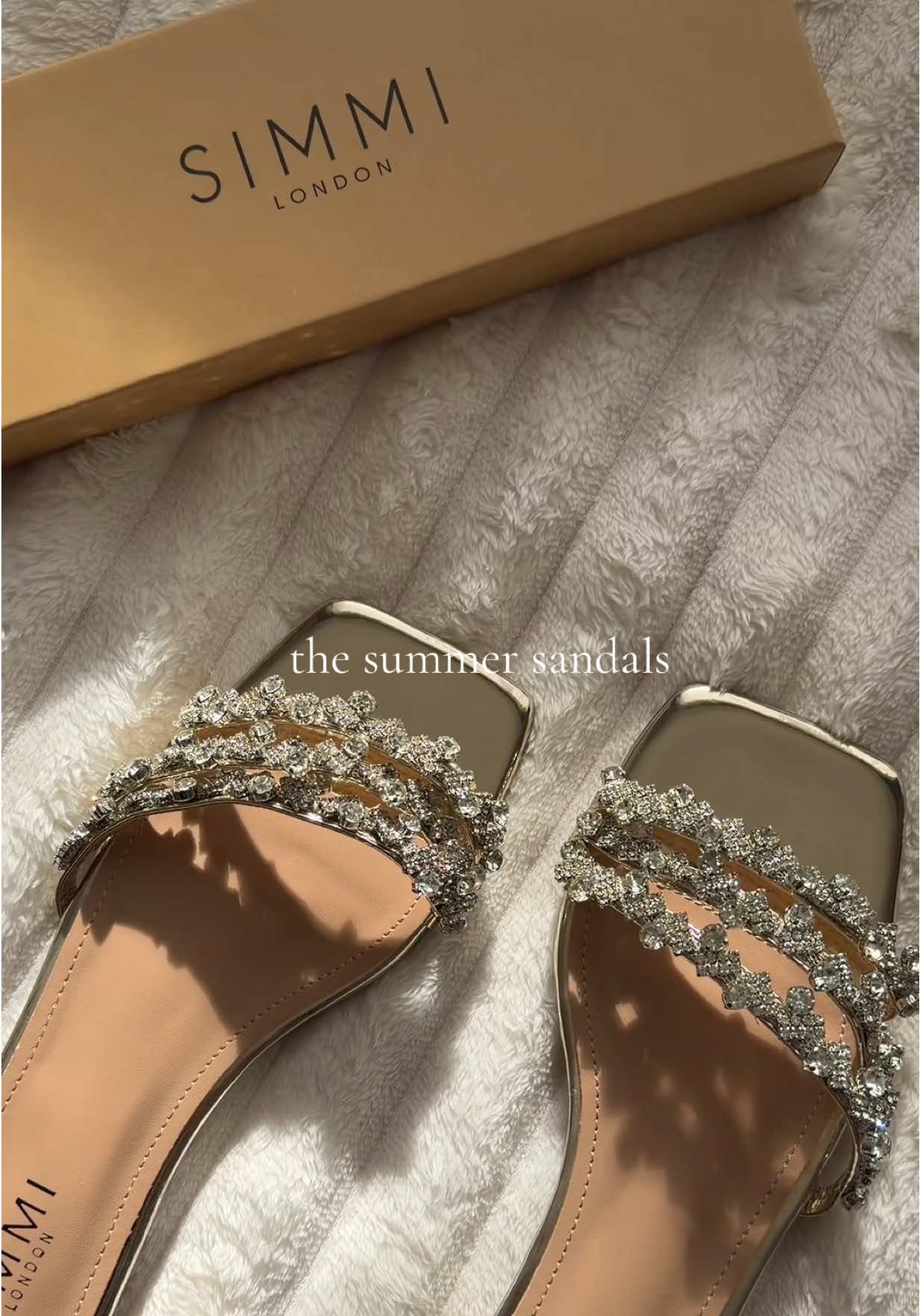 TikTok post by @mariaaax.o for SIMMI London. Caption reads: essential shoe for summer 🤍🌸💐☁️ #simmilondon....