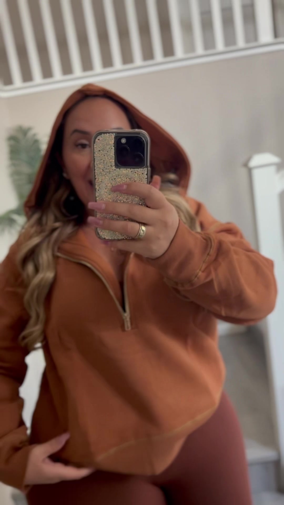 TikTok post by @curveslattesanddreams for PrettyGarden. Caption reads: @PrettyGarden #hoodie #gold #curvy #ootd [...].