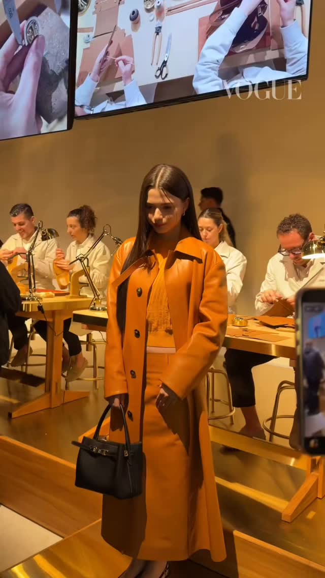 Instagram post by @freenbecky_official_germany for Tokopedia. Caption reads: She looks so good with Tod's 🔥🔥 REBECCA AT MFW....