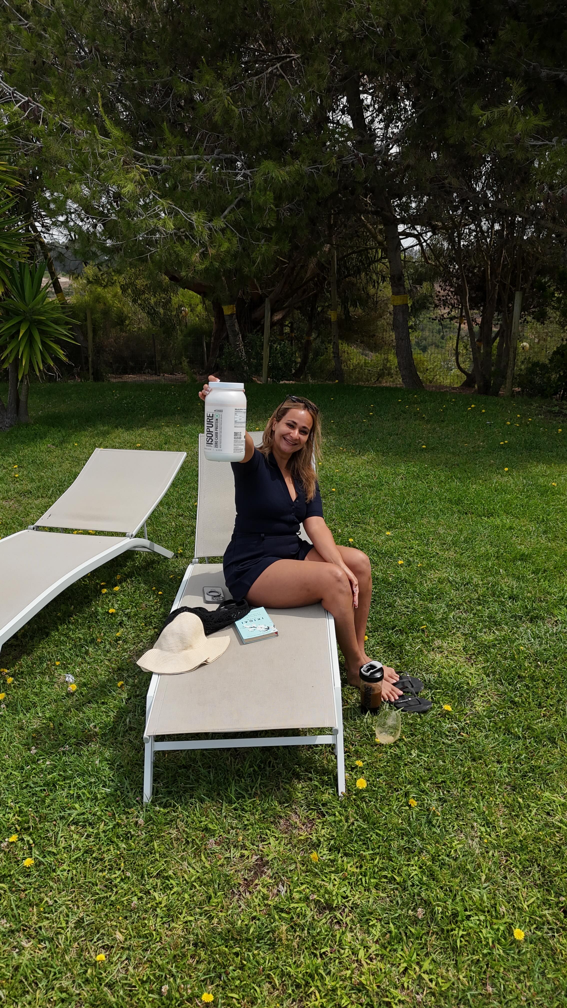 Instagram post by @pilotlaxmi for Isopure. Caption reads: “Work trip or vacation, my Isopure is always by my....