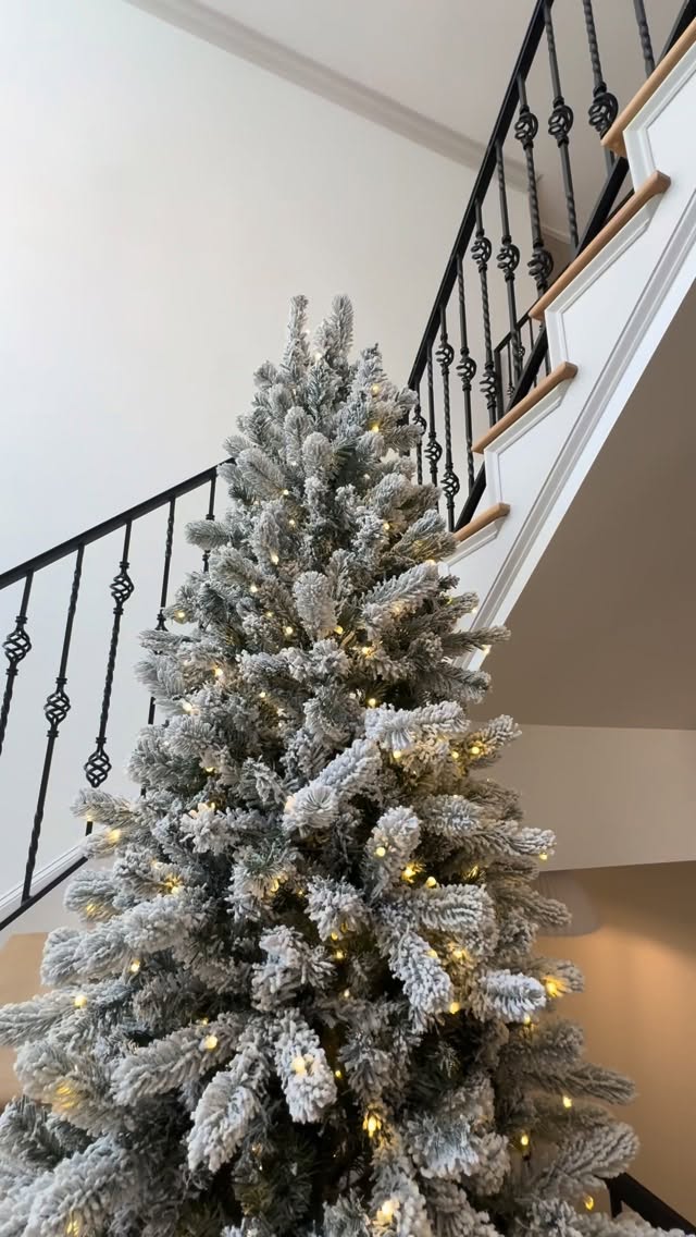Instagram post by an influencer for King of Christmas. Caption reads: [...] Flock® Slim Tree from @kingofchristmas .......