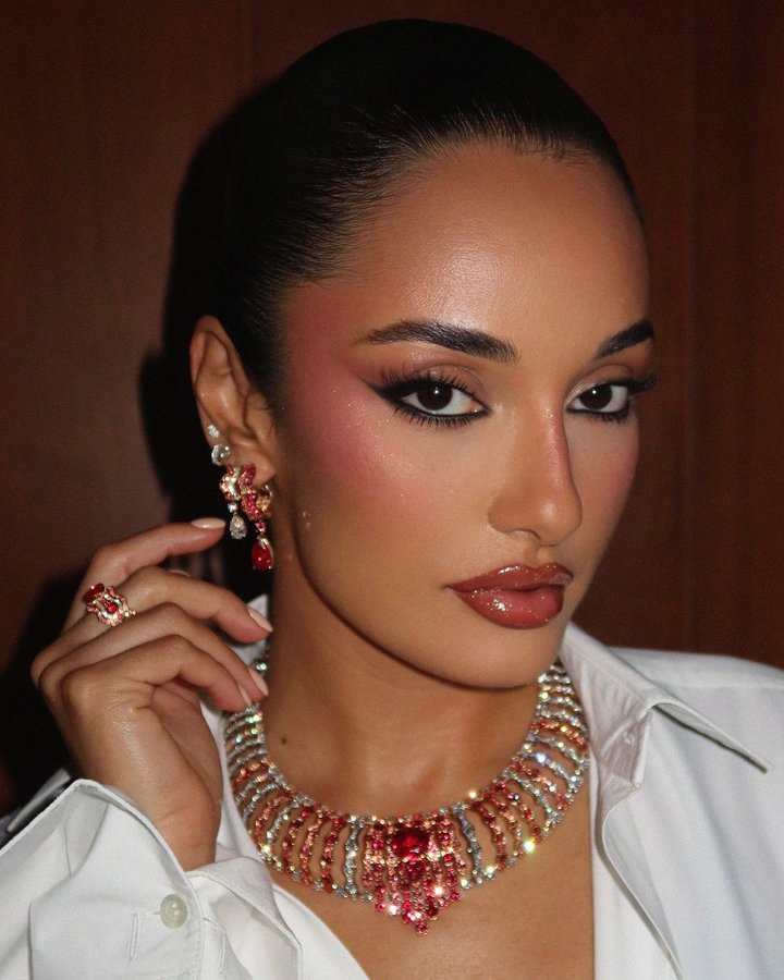 Instagram post by @aminamuaddi for Piaget. Caption reads: [...] me be on time.👆🏽Thank you for a beautiful....