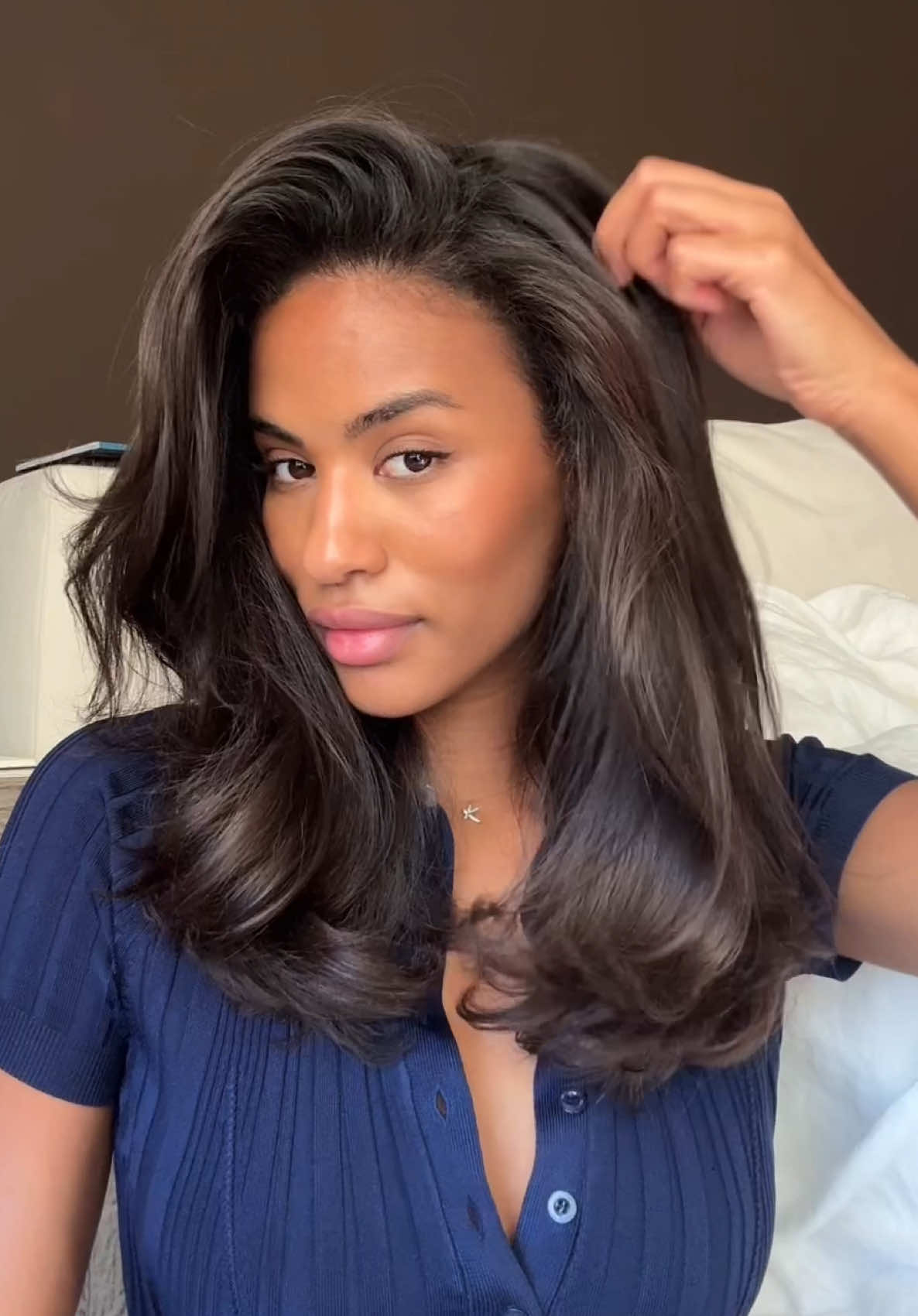 TikTok post by @kendrabailey_ for Aveda. Caption reads: My everyday blowout using @Aveda NEW Abundant....