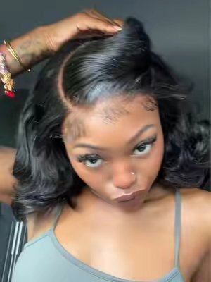 TikTok post by @kallmelanaaa for Menglle Hair. Caption reads: [...] this cute curly Glueless wig from @MENGLLE....