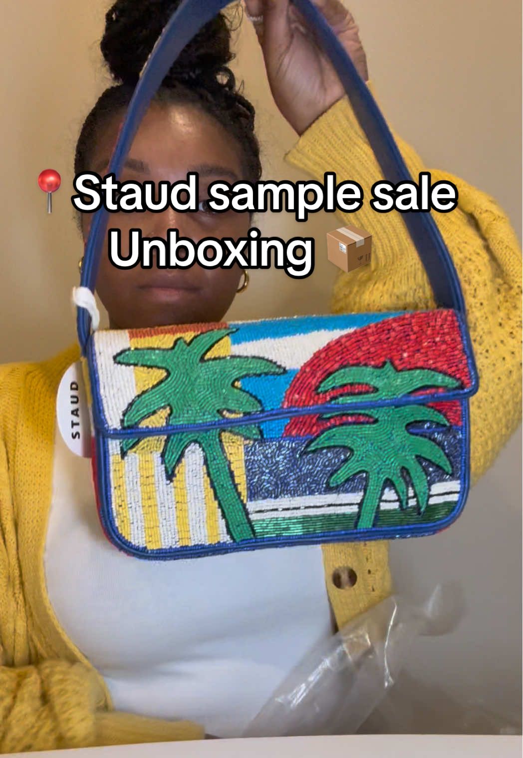 TikTok post by @raysimone91 for STAUD. Caption reads: [...] at the sample sale?? #fashiontiktok....