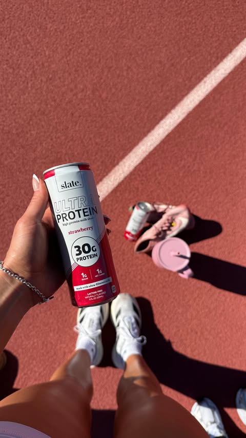 Instagram post by @kalia.estes for Slate Milk. Caption reads: run don't walk🏃‍♀️strawberry @slatemilk is now at....