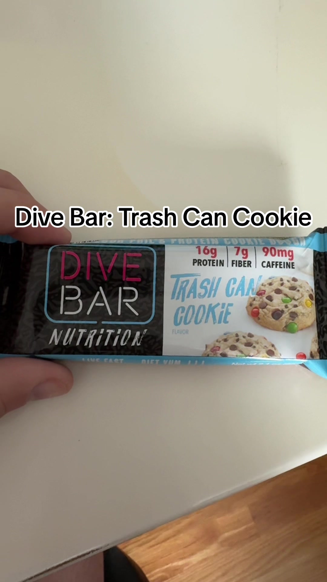 TikTok post by @tinofit for Dive Bar Nutrition. Caption reads: Dive Bar: Trash Can Cookie Caffeinated Protein Bar....