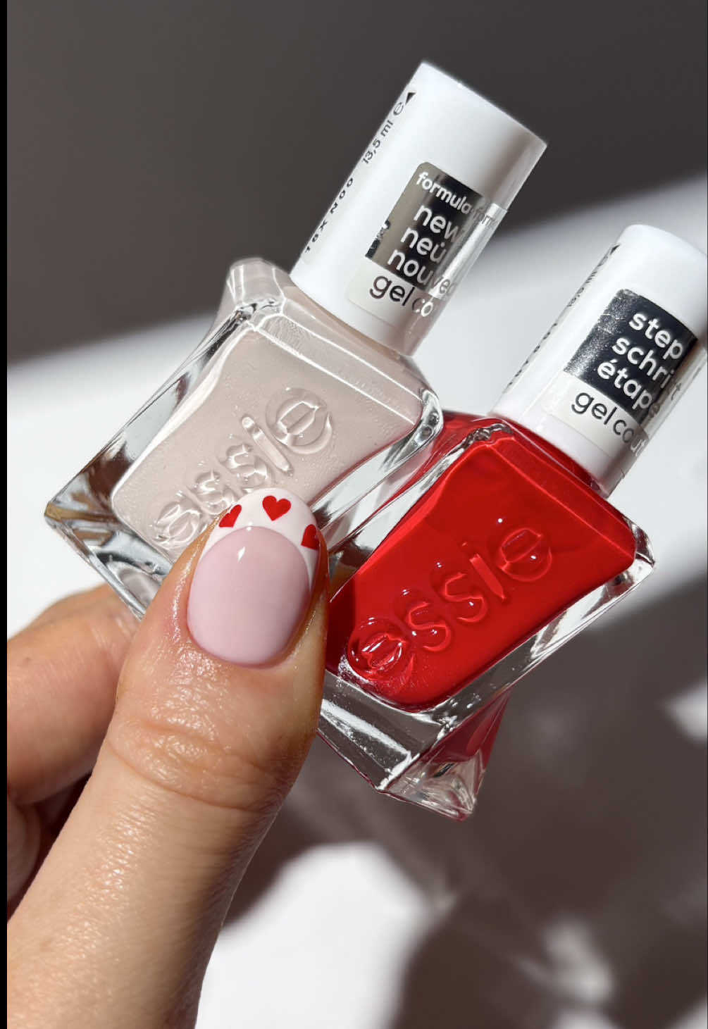 TikTok post by @thenaillologist for essie. Caption reads: [...] a bobby pin as my dotting tool with @essie....