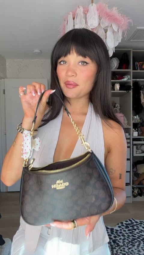 Instagram post by @summerrachelwarren for Coach. Caption reads: what’s in my Teri shoulder bag from @coach comment....