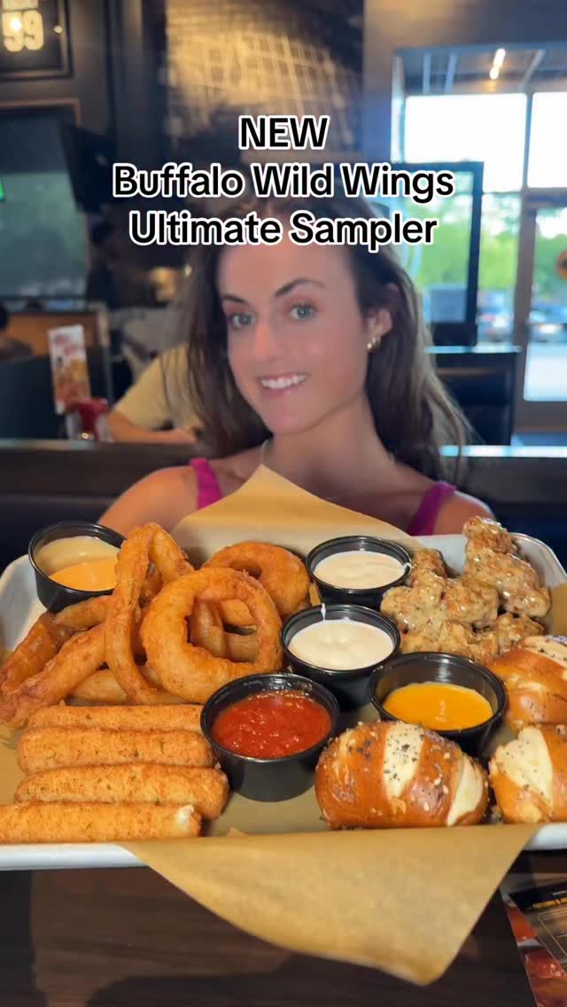 Instagram post by @sarahmargareteats for Buffalo Wild Wings. Caption reads: NEW Buffalo Wild Wings Ultimate Sampler....