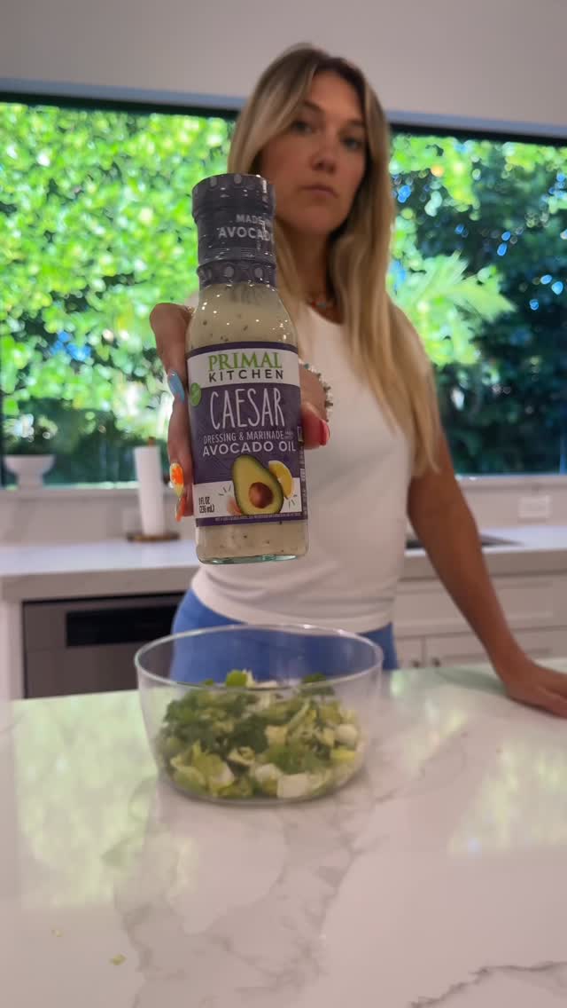 Instagram post by @calliegullickson for Primal Kitchen. Caption reads: Charles wanted in on my salad with....