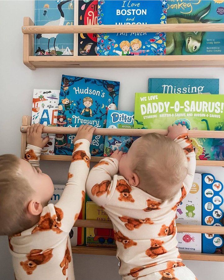 Instagram post by @the_banksfam for Wonderbly. Caption reads: The adorable Boston and Hudson enjoying their....