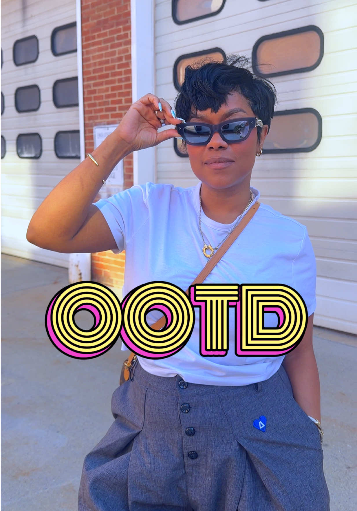 TikTok post by @kimmykouture for DEZI. Caption reads: [...] Clothing Pants @AELFRIC EDEN Shades @DEZI....