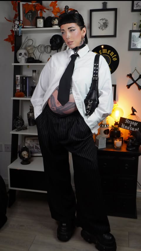 Instagram post by @amylouisehansonxo for Topshop. Caption reads: Chic bump fits- I got you 🫶🏻🖤⛓️

Follow for....