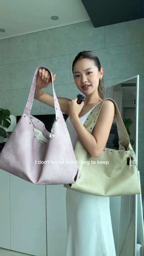 Instagram post by @ginacho23 for STAND OIL. Caption reads: [...] my sister the bag of the season too....