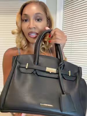 TikTok post by @katlee_333 for Newbella Fashion. Caption reads: Newbella Miranda handbag! Size Small is Perfect....