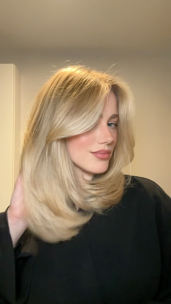 Instagram post by @juliaaluongo for Cake Beauty. Caption reads: big hair needs layers 🍰 using @cakebeauty big wig....