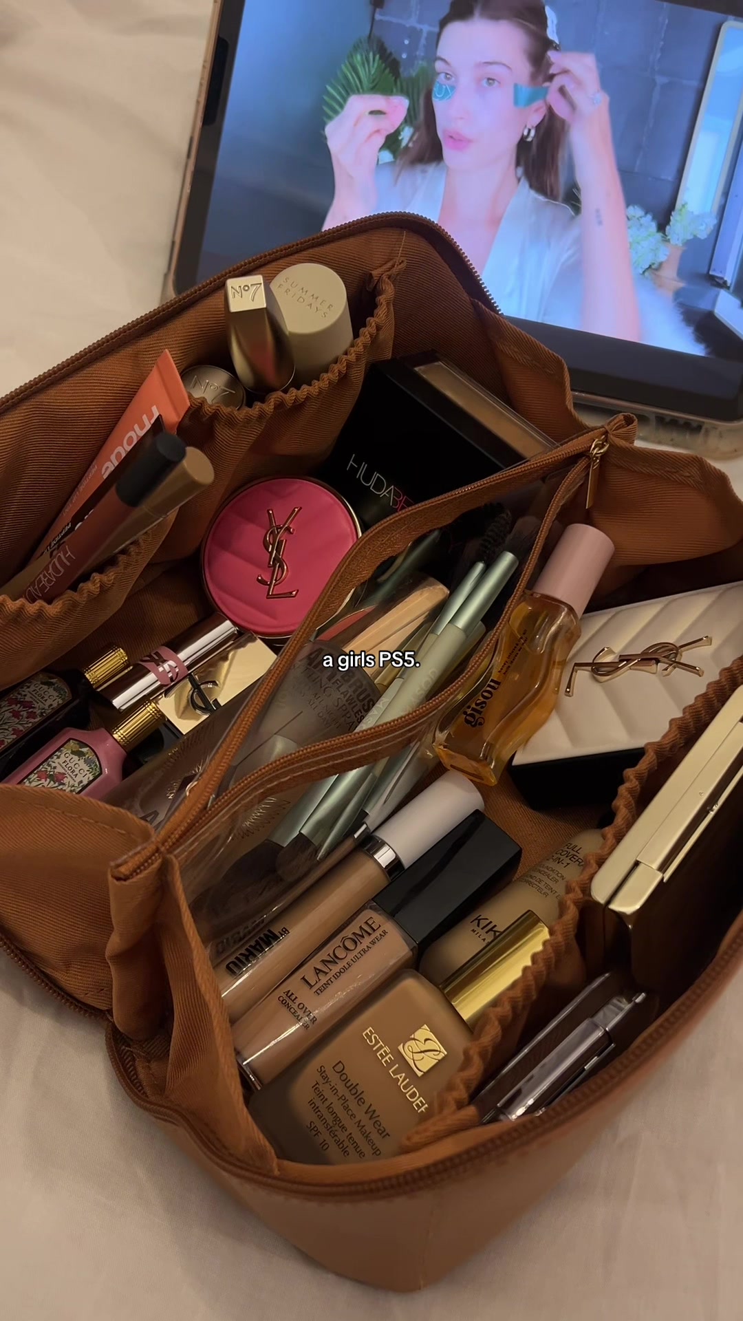 TikTok post by @znb.zhd for Rhode. Caption reads: [...] PS5🤎 . . . . @YSL Beauty @SAINT LAURENT....